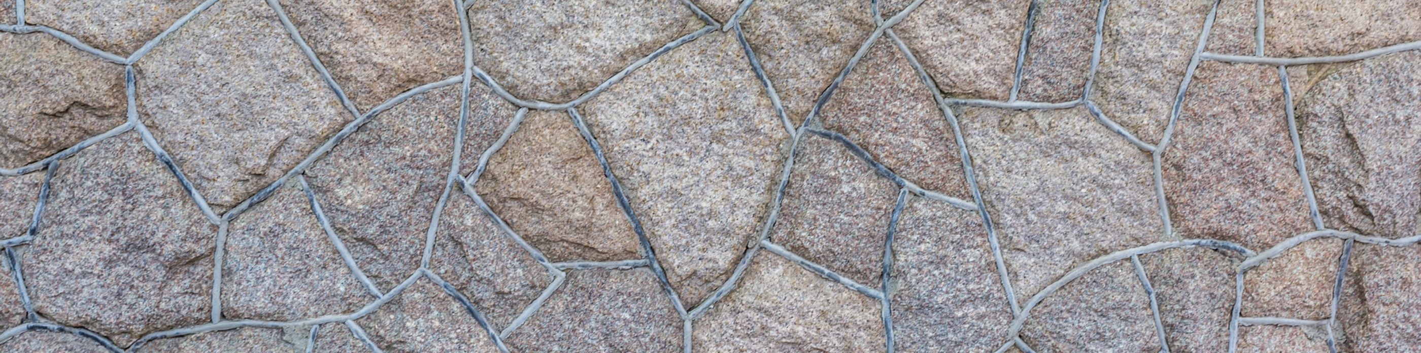 Interlocking stone at night lit by lights