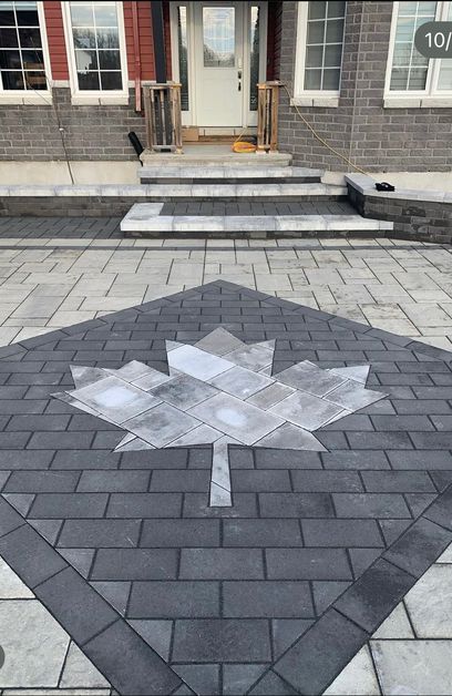 Stonework with maple leaf in center